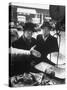 The Butcher Rationing the Amount of Meat Sold to the Customers Because of the Postwar Meat Shortage-Cornell Capa-Stretched Canvas