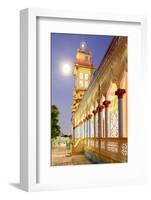 The Cao Dai temple in Vung Tau lit up at dusk with the full moon to the left of the tower, Vietnam-Brian Graney-Framed Photographic Print