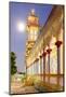 The Cao Dai temple in Vung Tau lit up at dusk with the full moon to the left of the tower, Vietnam-Brian Graney-Mounted Photographic Print