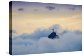 The Christ Statue (Cristo Redentor) on the summit of Corcovado mountain in a sea of clouds-Alex Robinson-Stretched Canvas