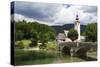 The church of St. John the Baptist and the stone bridge on Lake Bohinj, Slovenia, Europe-Sergio Pitamitz-Stretched Canvas