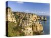 The cliffs and sea stacks of Ponta da Piedade, Algarve, Portugal.-Martin Zwick-Stretched Canvas