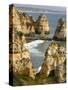 The cliffs and sea stacks of Ponta da Piedade, Algarve, Portugal.-Martin Zwick-Stretched Canvas