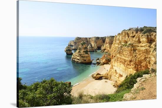 The coastal rock formations at Marinha beach (Praia da Marinha). Algarve, Portugal-Mauricio Abreu-Stretched Canvas