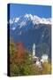 The colorful trees frame the alpine church and the snowy peaks, Soglio, Bregaglia Valley, Canton of-Roberto Moiola-Stretched Canvas