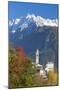 The colorful trees frame the alpine church and the snowy peaks, Soglio, Bregaglia Valley, Canton of-Roberto Moiola-Mounted Photographic Print