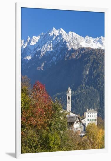 The colorful trees frame the alpine church and the snowy peaks, Soglio, Bregaglia Valley, Canton of-Roberto Moiola-Framed Photographic Print