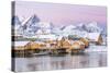 The Colors of Dawn Frame the Fishermen's Houses Surrounded by Frozen Sea, Sakrisoy, Reine-Roberto Moiola-Stretched Canvas