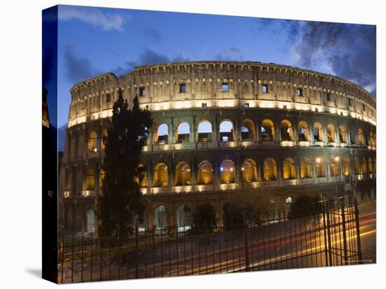 The Colosseum at Night with Traffic Trails, Rome, Lazio, Italy-Christian Kober-Stretched Canvas