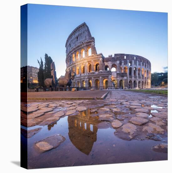The Colosseum (Flavian Amphitheatre), UNESCO World Heritage Site, reflected in a puddle at dusk, Ro-Roberto Moiola-Stretched Canvas