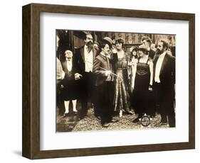 THE COUNT, foreground left: Charlie Chaplin, foreground second from right: Edna Purviance, 1916.-null-Framed Art Print