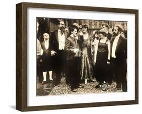 THE COUNT, foreground left: Charlie Chaplin, foreground second from right: Edna Purviance, 1916.-null-Framed Art Print