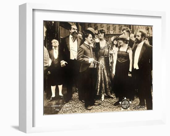 THE COUNT, foreground left: Charlie Chaplin, foreground second from right: Edna Purviance, 1916.-null-Framed Art Print