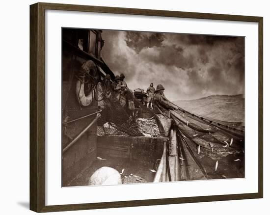 The Crew of a Yarmouth Herring Boat Pull in Their Catch on a Storm Tossed North Sea, 1935-null-Framed Photographic Print