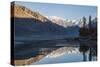 The crystal clear Shyok River creates a mirror image in the Khapalu valley near Skardu, Pakistan-Alex Treadway-Stretched Canvas