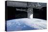 The Docking of Spacex Dragon to the International Space Station Above Earth-null-Stretched Canvas