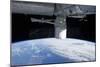 The Docking of Spacex Dragon to the International Space Station Above Earth-null-Mounted Photographic Print