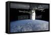 The Docking of Spacex Dragon to the International Space Station Above Earth-null-Framed Stretched Canvas