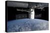 The Docking of Spacex Dragon to the International Space Station Above Earth-null-Stretched Canvas