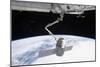 The Docking of Spacex Dragon to the International Space Station Above Earth-null-Mounted Photographic Print