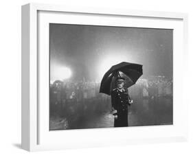 The Doorman Standing in the Rain Outside the Empire Theatre For the Royal Film Performance-Cornell Capa-Framed Photographic Print