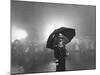 The Doorman Standing in the Rain Outside the Empire Theatre For the Royal Film Performance-Cornell Capa-Mounted Photographic Print