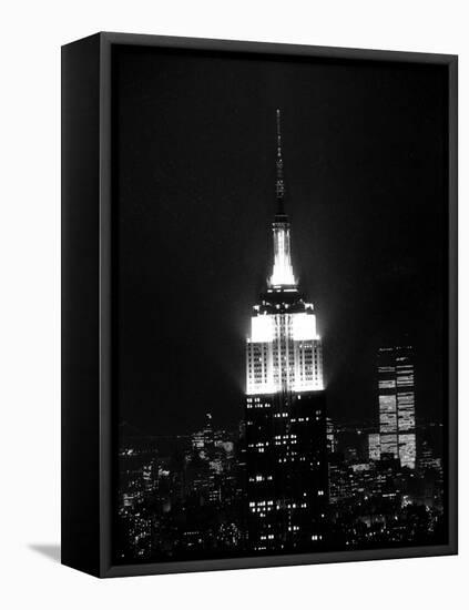 The Empire State Building Lights up at Night-null-Framed Stretched Canvas