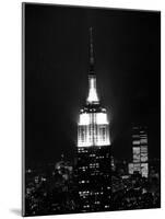 The Empire State Building Lights up at Night-null-Mounted Photographic Print