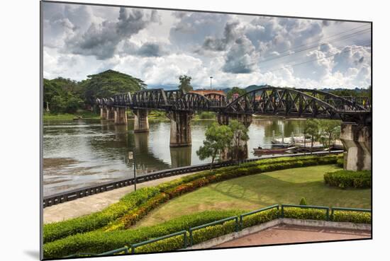 The Famous River Kwai Bridge in Kanchanaburi under a Cloudy Sky in Rainy Season, Thailand-smithore-Mounted Photographic Print