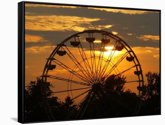 The Ferris Wheel at the Ingham County Fair is Silhouetted against the Setting Sun-null-Framed Stretched Canvas