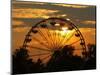 The Ferris Wheel at the Ingham County Fair is Silhouetted against the Setting Sun-null-Mounted Photographic Print
