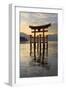 The Floating Miyajima Torii Gate of Itsukushima Shrine at Sunset-Stuart Black-Framed Photographic Print