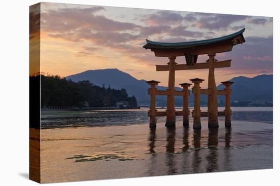 The Floating Miyajima Torii Gate of Itsukushima Shrine at Sunset-Stuart Black-Stretched Canvas