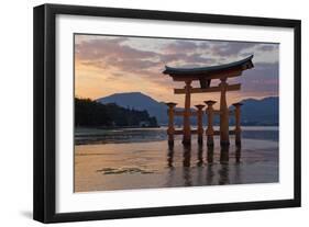 The Floating Miyajima Torii Gate of Itsukushima Shrine at Sunset-Stuart Black-Framed Photographic Print