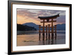 The Floating Miyajima Torii Gate of Itsukushima Shrine at Sunset-Stuart Black-Framed Photographic Print