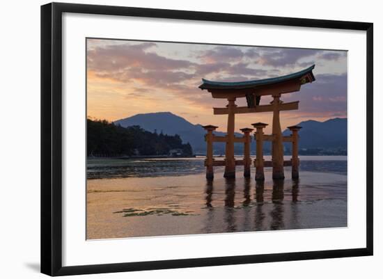 The Floating Miyajima Torii Gate of Itsukushima Shrine at Sunset-Stuart Black-Framed Photographic Print