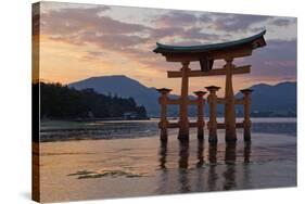 The Floating Miyajima Torii Gate of Itsukushima Shrine at Sunset-Stuart Black-Stretched Canvas