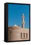 The fort of Nizwa. A scenic view of the fort at Nizwa, and its minaret. Nizwa, Oman.-Sergio Pitamitz-Framed Stretched Canvas