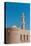 The fort of Nizwa. A scenic view of the fort at Nizwa, and its minaret. Nizwa, Oman.-Sergio Pitamitz-Stretched Canvas