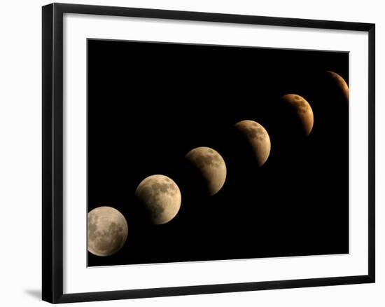 The Full Moon Slowly Loses its Fullness as the Earth's Shadow Crosses It-null-Framed Photographic Print