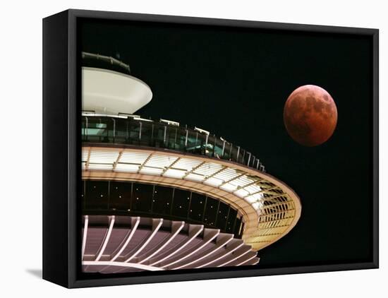 The Full Moon Turns Red and Orange as It Passes the Space Needle-null-Framed Stretched Canvas