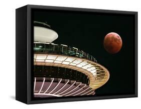 The Full Moon Turns Red and Orange as It Passes the Space Needle-null-Framed Stretched Canvas