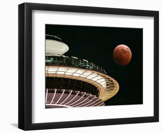 The Full Moon Turns Red and Orange as It Passes the Space Needle-null-Framed Photographic Print