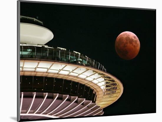 The Full Moon Turns Red and Orange as It Passes the Space Needle-null-Mounted Photographic Print