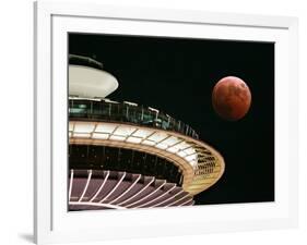 The Full Moon Turns Red and Orange as It Passes the Space Needle-null-Framed Photographic Print