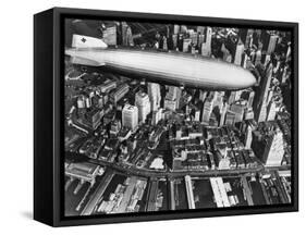 The German Airship, the Hindenburg, above Manhattan, New York in 1936, on its Way to its Berth at L-null-Framed Stretched Canvas