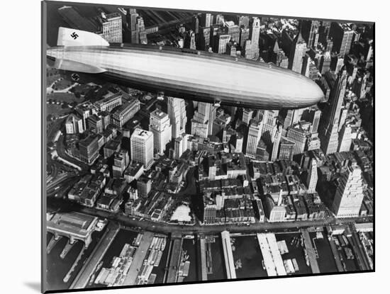 The German Airship, the Hindenburg, above Manhattan, New York in 1936, on its Way to its Berth at L-null-Mounted Photographic Print