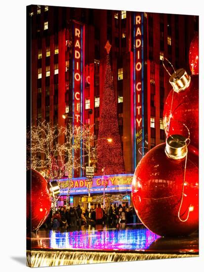 The Giant Christmas Ornaments on Sixth Avenue across from the Radio City Music Hall by Night-Philippe Hugonnard-Stretched Canvas