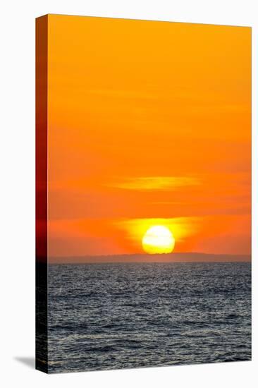 The golden setting sun reflects a gold glow on the beach at Pererenan Beach, Bali, Indonesia-Greg Johnston-Stretched Canvas