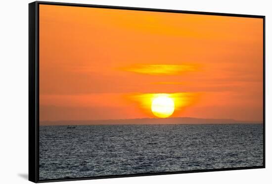 The golden setting sun reflects a gold glow on the beach at Pererenan Beach, Bali, Indonesia-Greg Johnston-Framed Stretched Canvas